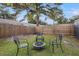 Private backyard with fire pit and seating area at 15111 Verona Ave, Clearwater, FL 33760