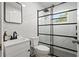 Bathroom showcasing a glass shower door, modern vanity, and updated fixtures at 15111 Verona Ave, Clearwater, FL 33760