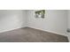 Spacious bedroom with neutral colored walls and carpet at 15111 Verona Ave, Clearwater, FL 33760
