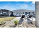 Relaxing backyard with patio, screened enclosure and lush lawn at 1719 S Pebble Beach Blvd, Sun City Center, FL 33573