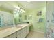 Bright bathroom with shower/tub combo, updated vanity, and coastal decor at 1719 S Pebble Beach Blvd, Sun City Center, FL 33573