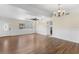 Bright living room with hardwood floors, neutral walls, and a ceiling fan at 1730 Audrey Dr, Clearwater, FL 33759