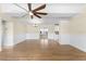 Bright living room with hardwood floors, neutral walls, and a ceiling fan at 1730 Audrey Dr, Clearwater, FL 33759