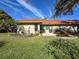 Landscaped backyard with patio and grassy area at 2281 Lake Arbor Blvd, Clearwater, FL 33763