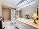 Bathroom with tub shower, toilet and vanity at 2281 Lake Arbor Blvd, Clearwater, FL 33763