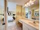 Bright bathroom with single sink vanity, and view of bedroom at 2281 Lake Arbor Blvd, Clearwater, FL 33763