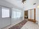 Bright room with tiled flooring, white-painted walls, and a sliding door at 2281 Lake Arbor Blvd, Clearwater, FL 33763