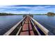Long wooden dock extending into the lake at 2281 Lake Arbor Blvd, Clearwater, FL 33763