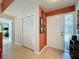 Inviting entryway with a wood-look floor, bi-fold closet, and a stylish front door with side window at 2281 Lake Arbor Blvd, Clearwater, FL 33763