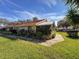 Side view of house showing landscaping and walkway at 2281 Lake Arbor Blvd, Clearwater, FL 33763