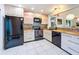 Modern kitchen featuring stainless steel appliances, updated cabinets, and sleek countertops at 2281 Lake Arbor Blvd, Clearwater, FL 33763