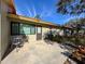 Private patio with table and chairs, perfect for outdoor dining at 2281 Lake Arbor Blvd, Clearwater, FL 33763