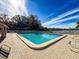 Community pool with lounge chairs and waterfront view at 2281 Lake Arbor Blvd, Clearwater, FL 33763