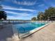 Refreshing community pool with lake views and lounge area at 2281 Lake Arbor Blvd, Clearwater, FL 33763