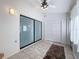 Sunroom with tiled floor, sliding glass doors, and closet at 2281 Lake Arbor Blvd, Clearwater, FL 33763