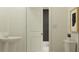 Clean bathroom with pedestal sink, toilet, and modern decor at 2643 Sunray Venus Way, Ruskin, FL 33570