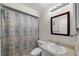 This bathroom features tile floors, a vanity and sink, a toilet, and a shower with a curtain at 2679 Sabal Springs Cir # 203, Clearwater, FL 33761