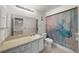 This bathroom features tile floors, a vanity and sink, a toilet, and a shower with a curtain at 2679 Sabal Springs Cir # 203, Clearwater, FL 33761