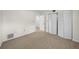 The bedroom offers neutral carpet and closet space at 2679 Sabal Springs Cir # 203, Clearwater, FL 33761
