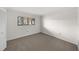 A bedroom with a neutral carpet, a window, base trim and electrical outlets at 2679 Sabal Springs Cir # 203, Clearwater, FL 33761