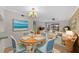 Bright dining area with table and chairs, view to living room and patio at 2679 Sabal Springs Cir # 203, Clearwater, FL 33761