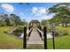 A wooden dock with a gazebo at 2679 Sabal Springs Cir # 203, Clearwater, FL 33761