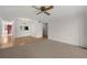 Open-concept living room with hardwood floors, and a view into the connected kitchen at 2679 Sabal Springs Cir # 203, Clearwater, FL 33761