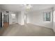 Spacious main bedroom with neutral carpet, ceiling fan, natural light and ensuite bathroom at 2679 Sabal Springs Cir # 203, Clearwater, FL 33761
