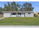 Charming single-story home with a well-manicured lawn and attached one-car garage at 4951 86Th N Ave, Pinellas Park, FL 33782