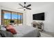 Bedroom with large TV and balcony access at 6 Belleview Blvd # 708, Belleair, FL 33756