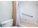 Bathroom with shower, toilet, and grab bar at 6145 Sun Blvd # 607, St Petersburg, FL 33715