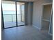 Bright room with tiled floor leading to private balcony with waterfront views, bathed in natural light at 6145 Sun Blvd # 607, St Petersburg, FL 33715