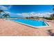 Refreshing community pool area with water views and lounge chairs at 6145 Sun Blvd # 607, St Petersburg, FL 33715