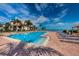 Inviting community pool with lounge chairs and waterfront views at 6145 Sun Blvd # 607, St Petersburg, FL 33715