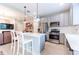 Modern kitchen with island, stainless steel appliances, and white quartz countertops at 6356 Camino Dr, Apollo Beach, FL 33572