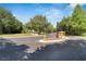 Community entrance with stone signage and landscaping at 6912 Rock Springs Way, Tampa, FL 33625