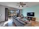 Relaxing living room featuring hardwood floors and sliding glass doors at 6912 Rock Springs Way, Tampa, FL 33625