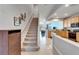 Interior view of carpeted staircase and kitchen at 6912 Rock Springs Way, Tampa, FL 33625