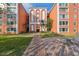 Inviting entryway with well-manicured landscaping leading to the building entrance at 6960 20Th N Ave # 306, St Petersburg, FL 33710