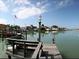 Wooden dock with seating overlooking the water at 7906 9Th S Ave, St Petersburg, FL 33707