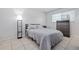 Bright bedroom with double bed and ample closet space at 8209 Rugby Ct, Hudson, FL 34667