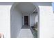 Covered entryway with arched entry and decorative door at 8209 Rugby Ct, Hudson, FL 34667