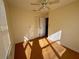 Simple bedroom with wood floors and ceiling fan at 822 Gulf Blvd # 4-6, Indian Rocks Beach, FL 33785