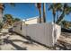Side view of beach cottage with white fence at 822 Gulf Blvd # 4-6, Indian Rocks Beach, FL 33785
