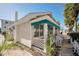 Another view of charming cottage with teal awning at 822 Gulf Blvd # 4-6, Indian Rocks Beach, FL 33785
