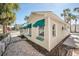 Side view of beach cottage with teal awnings at 822 Gulf Blvd # 4-6, Indian Rocks Beach, FL 33785