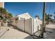 Cute cottage with a white picket fence and a paved driveway at 822 Gulf Blvd # 4-6, Indian Rocks Beach, FL 33785