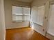 Sunlit room with laminate flooring and window blinds at 822 Gulf Blvd # 4-6, Indian Rocks Beach, FL 33785