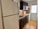 Cozy kitchen with dark cabinets and modern appliances at 822 Gulf Blvd # 4-6, Indian Rocks Beach, FL 33785