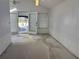 Bright living room with white walls and access to a patio at 822 Gulf Blvd # 4-6, Indian Rocks Beach, FL 33785